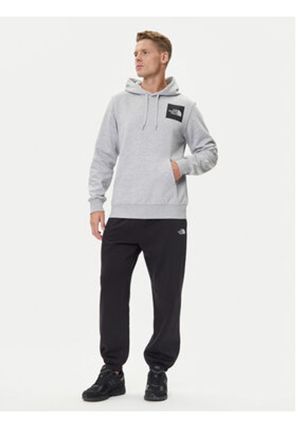 The North Face Spodnie dresowe Essential NF0A8C1F Czarny Relaxed Fit. Kolor: czarny. Materiał: syntetyk, bawełna