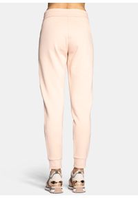Spodnie dresowe damskie różowe Armani Exchange 8NYPFX YJ68Z 14AA. Kolor: różowy. Materiał: dresówka
