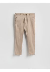 Reserved - Spodnie joggery - beżowy. Kolor: beżowy. Materiał: tkanina, bawełna