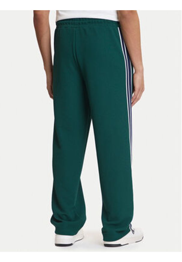 Guess Spodnie dresowe Z6GB14 K3211 Zielony Regular Fit. Kolor: zielony. Materiał: syntetyk