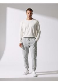 Sinsay - Spodnie dresowe cargo - szary. Kolor: szary. Materiał: dresówka