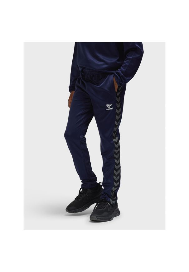 Dziecięce spodnie dresowe z poliestru Hummel Authentic. Kolor: niebieski. Materiał: dresówka, poliester. Sport: piłka nożna