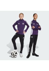 Adidas - Spodnie Manchester United Tiro 25 Competition Training Kids. Kolor: fioletowy, czarny, wielokolorowy