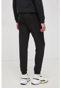 New Era Spodnie męskie kolor czarny gładkie. Kolor: czarny. Materiał: dzianina. Wzór: gładki #4