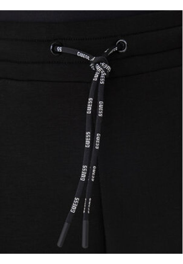 Guess Spodnie dresowe V2YB18 K7UW2 Czarny Regular Fit. Kolor: czarny. Materiał: wiskoza