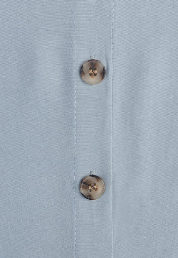 Born2be - Jasnoniebieska Trapezowa Sukienka z Wiązanym Paskiem Brystia. Kolor: niebieski. Materiał: materiał. Sezon: wiosna, lato. Typ sukienki: trapezowe