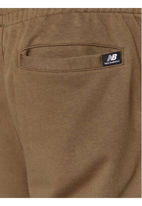New Balance Spodnie dresowe Essentials Stacked Logo French Terry Sweatpant MP31539 Brązowy Regular Fit. Kolor: brązowy. Materiał: bawełna, syntetyk