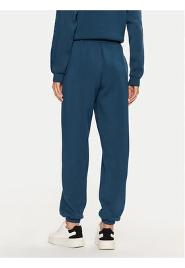 Guess Spodnie dresowe V4BB13 K7UW2 Niebieski Regular Fit. Kolor: niebieski. Materiał: wiskoza