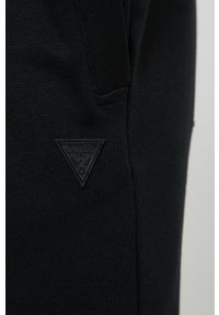 Guess Spodnie męskie kolor czarny melanżowe. Kolor: czarny. Materiał: bawełna, materiał, dzianina, włókno. Wzór: melanż #3