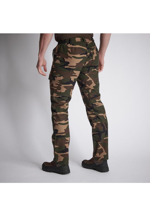SOLOGNAC - Spodnie Solognac Steppe 300 camo wytrzymałe. Kolor: zielony. Materiał: poliester, materiał, bawełna