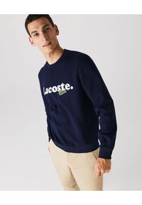 Lacoste - LACOSTE - Bawełniana bluza z logo. Okazja: na co dzień. Typ kołnierza: bez kaptura. Kolor: niebieski. Materiał: bawełna. Długość rękawa: długi rękaw. Długość: długie. Wzór: haft. Styl: klasyczny, casual #1