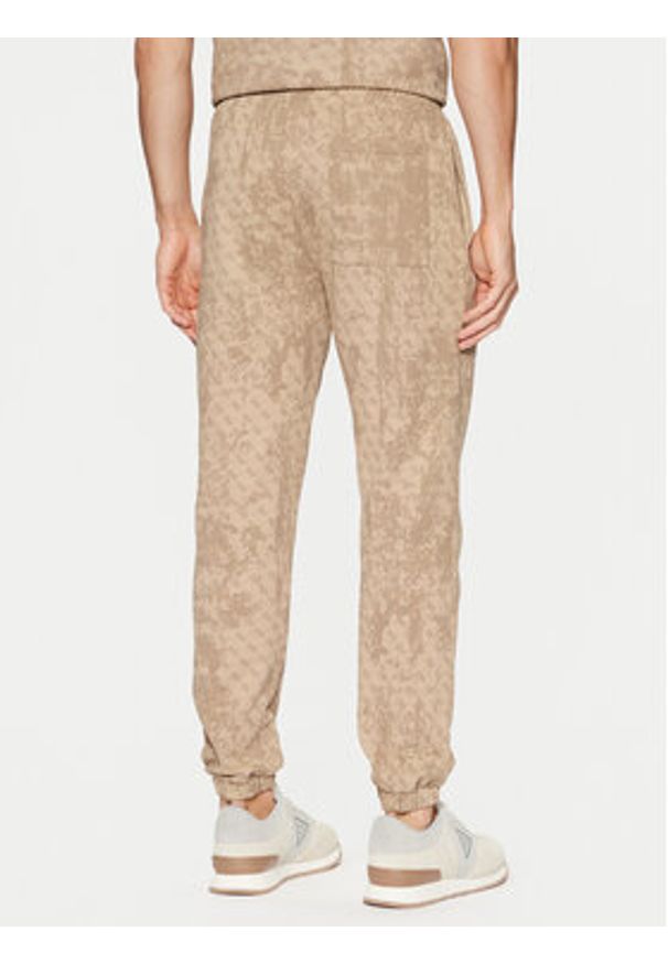 Guess Spodnie dresowe Z5RB14 K9YI1 Beżowy Regular Fit. Kolor: beżowy. Materiał: bawełna
