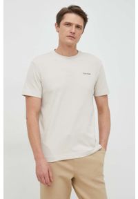 Calvin Klein t-shirt bawełniany kolor beżowy. Kolor: beżowy. Materiał: bawełna