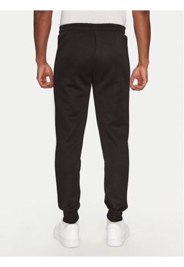 Puma Spodnie dresowe T7 Always On 629588 Czarny Regular Fit. Kolor: czarny. Materiał: syntetyk, bawełna