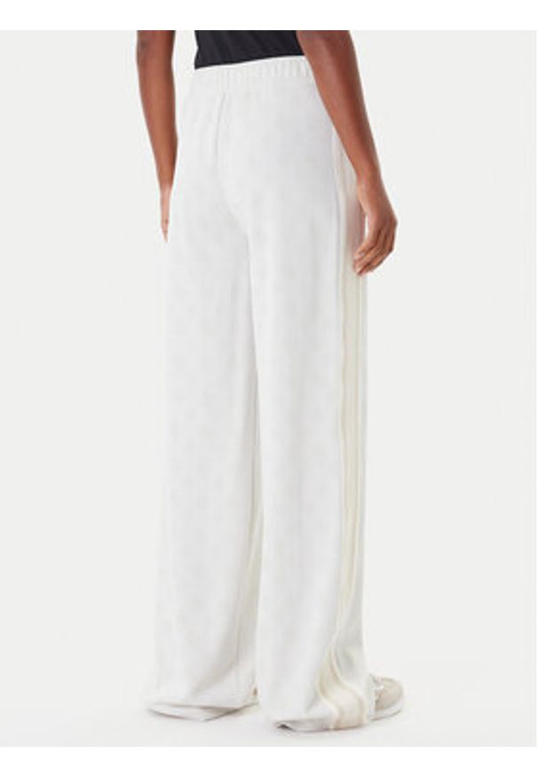 Guess Spodnie dresowe V5YB10 K0282 Écru Relaxed Fit. Materiał: syntetyk