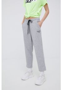 DKNY - Dkny spodnie dresowe damskie kolor szary z nadrukiem. Kolor: szary. Materiał: dresówka. Wzór: nadruk