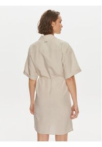 Calvin Klein Sukienka koszulowa K20K206697 Beżowy Relaxed Fit. Kolor: beżowy. Materiał: lyocell. Typ sukienki: koszulowe