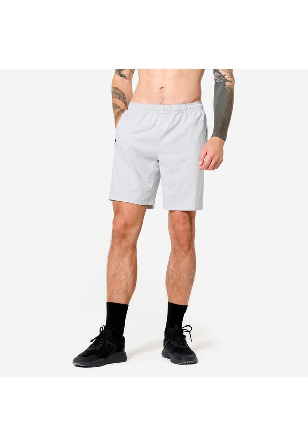 DOMYOS - Spodenki fitness męskie z kieszeniami. Kolor: szary. Materiał: poliester, materiał, elastan. Sport: fitness