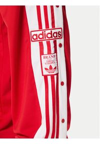 Adidas - adidas Spodnie dresowe Adibreak JP3765 Czerwony Regular Fit. Kolor: czerwony. Materiał: syntetyk