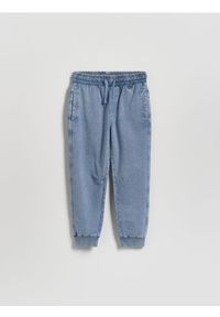 Reserved - Joggery z efektem sprania - niebieski. Kolor: niebieski. Materiał: dzianina, bawełna #1