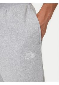 The North Face Spodnie dresowe Essential NF0A8C1F Szary Relaxed Fit. Kolor: szary. Materiał: bawełna