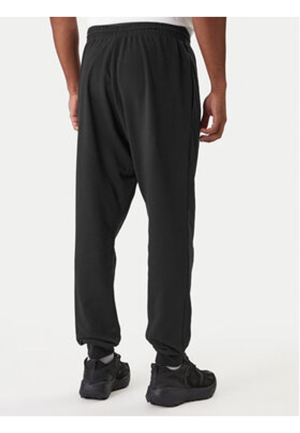 Adidas - adidas Spodnie dresowe Essentials Feel Cozy JE3854 Czarny Regular Fit. Kolor: czarny. Materiał: syntetyk, bawełna