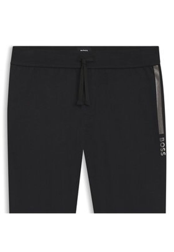 BOSS Spodnie dresowe Authentic 50545565 Czarny Slim Fit. Kolor: czarny. Materiał: bawełna