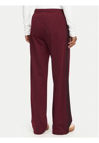 Adidas - adidas Spodnie dresowe Firebird Loose Tracksuit KS4669 Bordowy Loose Fit. Kolor: czerwony. Materiał: syntetyk #5