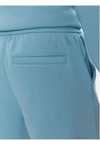 Calvin Klein Jeans Szorty sportowe Monologo J30J325131 Niebieski Regular Fit. Kolor: niebieski. Materiał: syntetyk. Styl: sportowy