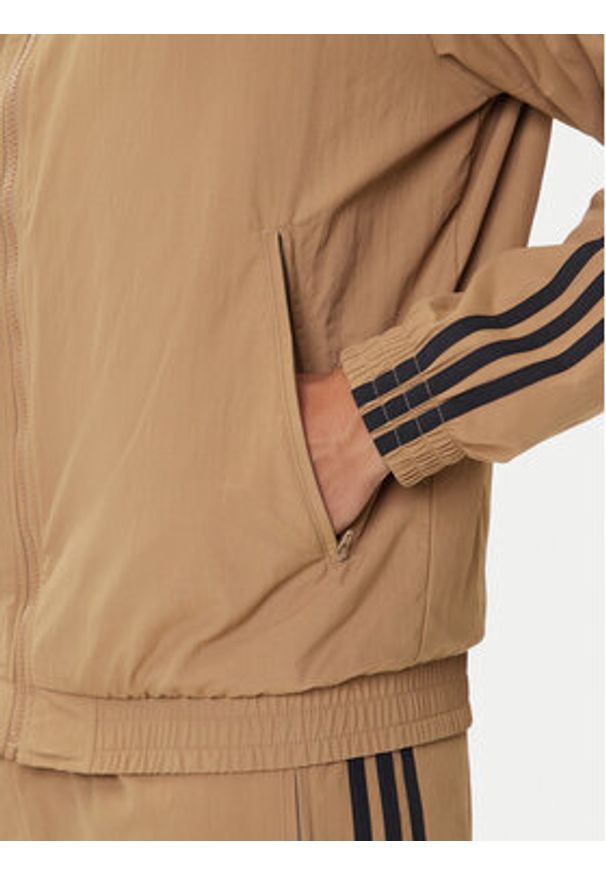 Adidas - adidas Bluza adicolor Woven Firebird JY1333 Beżowy Loose Fit. Kolor: beżowy. Materiał: syntetyk