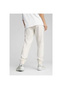 Puma - Damskie spodnie dresowe ESS ELEVATED PUMA No Dye Color Mix. Materiał: dresówka