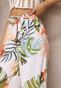 Renee - Białe Spodnie Szerokie Sofadia. Okazja: na co dzień. Stan: podwyższony. Kolor: biały. Materiał: materiał. Wzór: aplikacja, paski, nadruk. Styl: casual #3