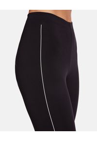 Wolford - WOLFORD - Czarne legginsy z logo. Stan: podwyższony. Kolor: czarny. Materiał: tkanina. Długość: długie