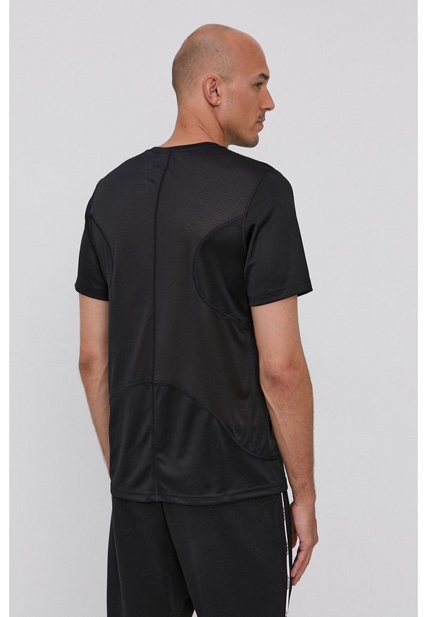 Reebok - T-shirt. Okazja: na co dzień. Kolor: czarny. Materiał: dzianina, poliester. Wzór: gładki. Styl: casual