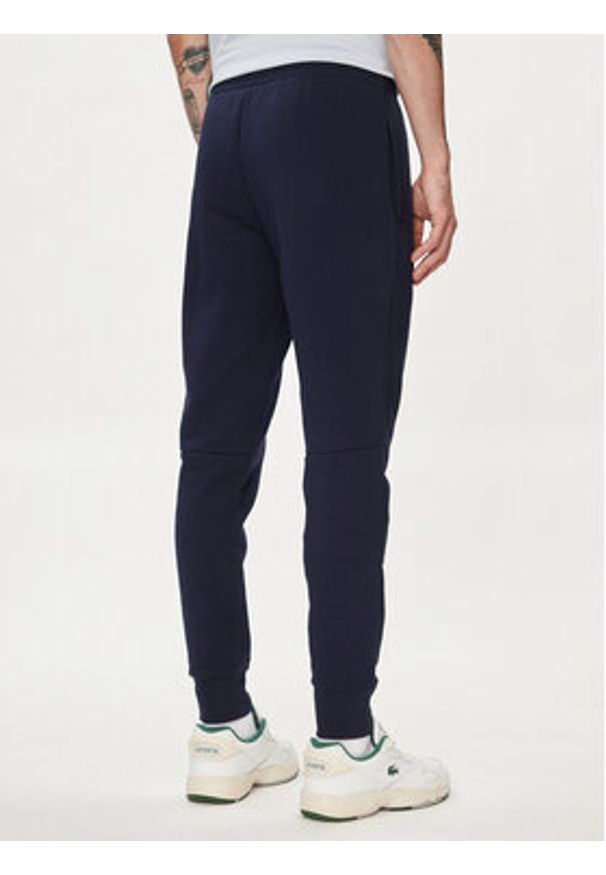 Lacoste Spodnie dresowe XH9624 Granatowy Regular Fit. Kolor: niebieski. Materiał: bawełna