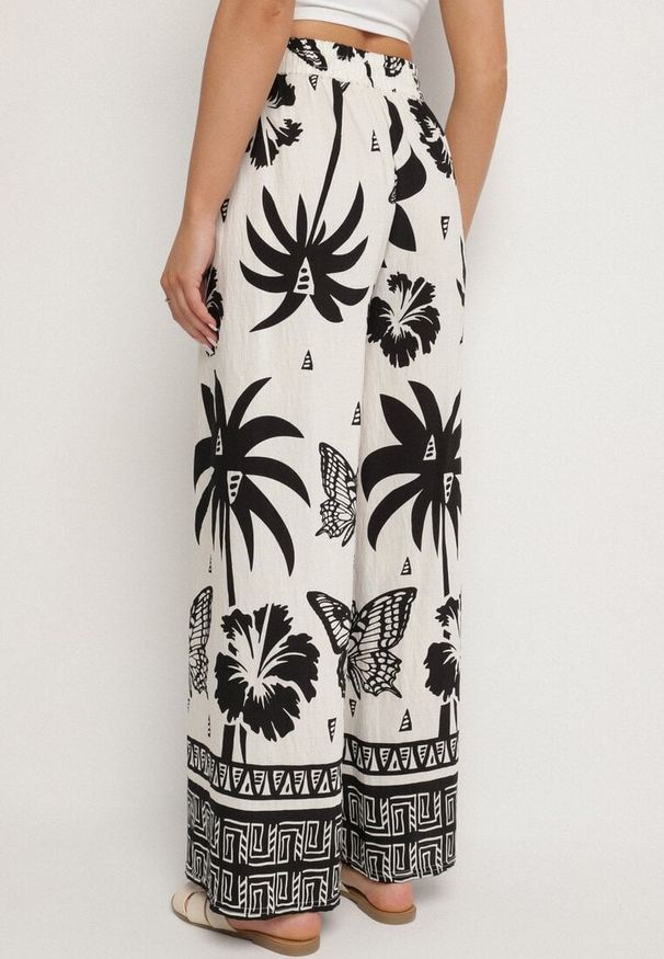 Born2be - Czarno-Beżowe Spodnie z Tropikalnym Wzorem i Szerokimi Nogawkami Emivelli. Okazja: na co dzień. Kolor: czarny. Styl: casual, elegancki