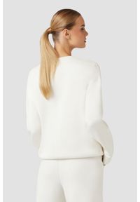 Guess - GUESS Damska bluza w kolorze ecru Cecilia. Kolor: beżowy