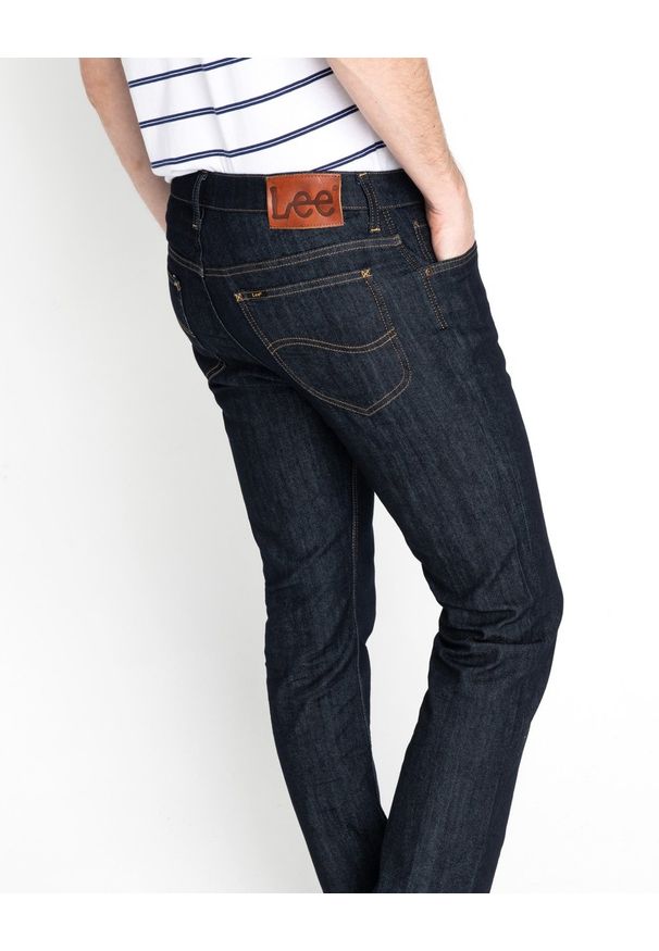 Lee - MĘSKIE SPODNIE JEANSOWE LEE RIDER RINSE L701AA36 112117271