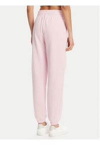 Under Armour Spodnie dresowe Ua Rival 1382735 Różowy Loose Fit. Kolor: różowy. Materiał: bawełna