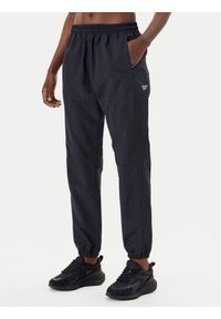 Reebok Spodnie dresowe Vector 100221435 Czarny Relaxed Fit. Kolor: czarny. Materiał: syntetyk
