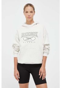 Reebok Classic bluza bawełniana damska kolor beżowy z kapturem z aplikacją. Typ kołnierza: kaptur. Kolor: beżowy. Materiał: bawełna. Długość rękawa: długi rękaw. Długość: długie. Wzór: aplikacja #2