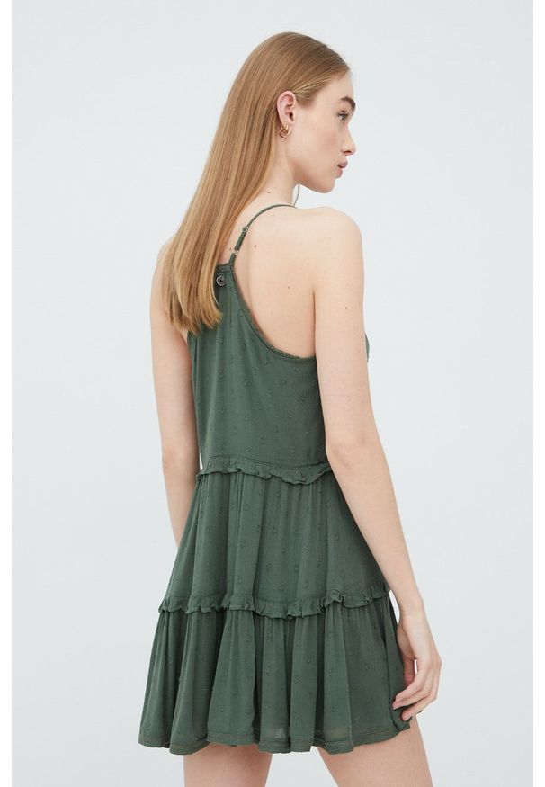 Superdry sukienka kolor zielony mini rozkloszowana. Kolor: zielony. Długość rękawa: na ramiączkach. Typ sukienki: rozkloszowane. Długość: mini