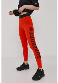 Superdry - Legginsy. Kolor: pomarańczowy. Materiał: dzianina. Wzór: nadruk #5