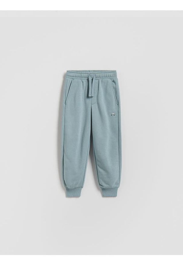 Reserved - Bawełniane spodnie jogger - jasnoniebieski. Kolor: niebieski. Materiał: bawełna