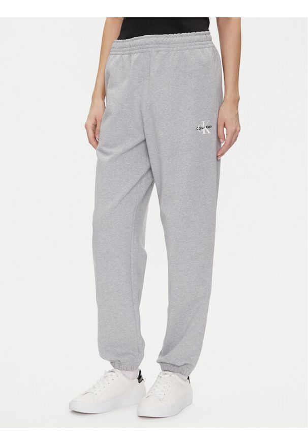 Calvin Klein Jeans Spodnie dresowe Monologo LV047B235G Szary Regular Fit. Kolor: szary. Materiał: bawełna