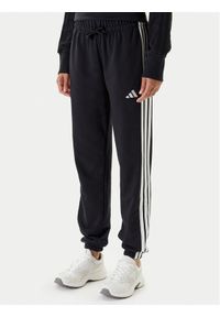 Adidas - adidas Spodnie dresowe Essentials 3-Stripes JD5302 Czarny Regular Fit. Kolor: czarny. Materiał: bawełna