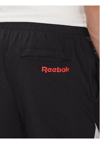 Reebok Spodnie dresowe 100223963 Czarny Regular Fit. Kolor: czarny. Materiał: syntetyk #3