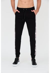 MOSCHINO Czarne męskie spodnie dresowe z lampasami, Rozmiar L. Kolor: czarny. Materiał: dresówka #1