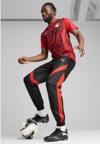 Puma - Męskie spodnie przedmeczowe Egipt PUMA Black Red. Kolor: czerwony, wielokolorowy, czarny. Sport: piłka nożna