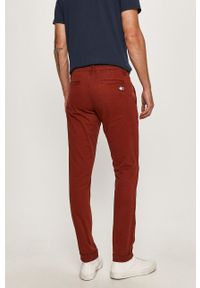 Tommy Jeans - Spodnie DM0DM06518. Kolor: czerwony. Materiał: tkanina, bawełna, elastan. Wzór: gładki #4